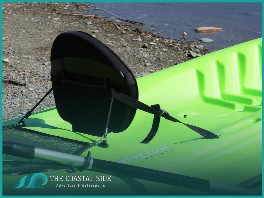 Green kayak in the shore