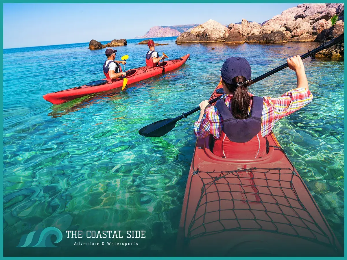 A group of people kayaking in clear water