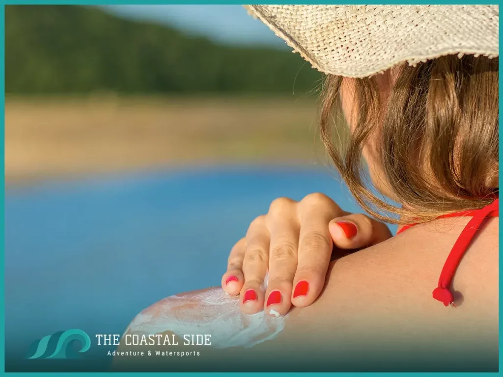 Woman applying sunscreen