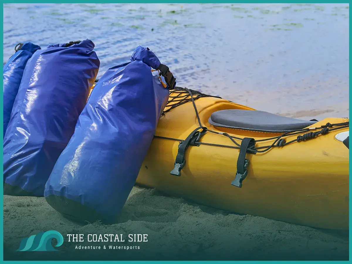 Yellow kayak with blue extra packs