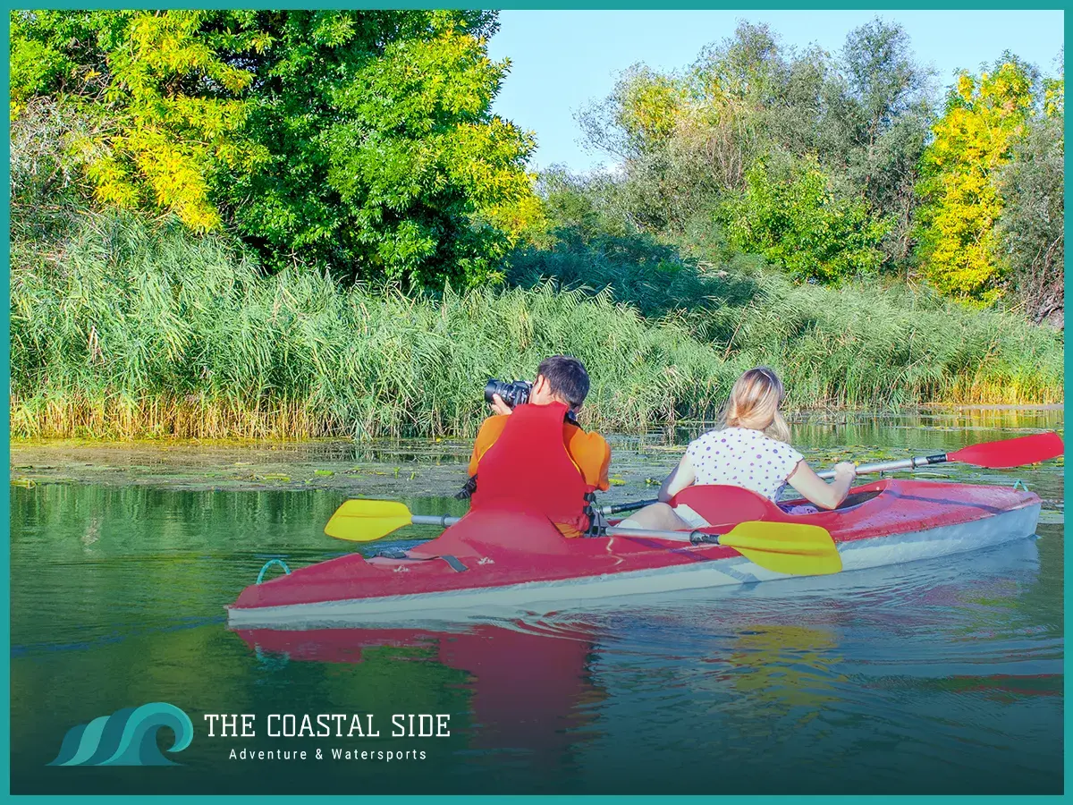 A man and woman kayaking in a tandem kayak