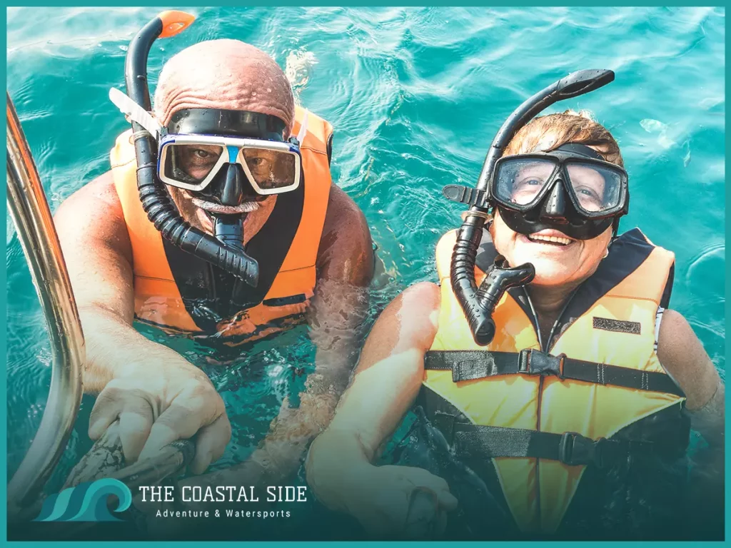 Adults snorkeling in clear blue water