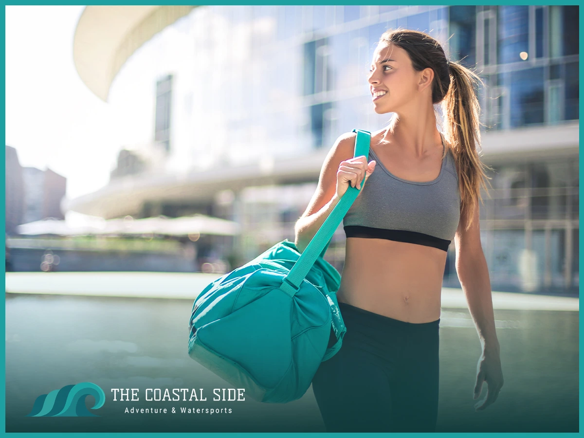 Woman leaving the gym with a duffle bag