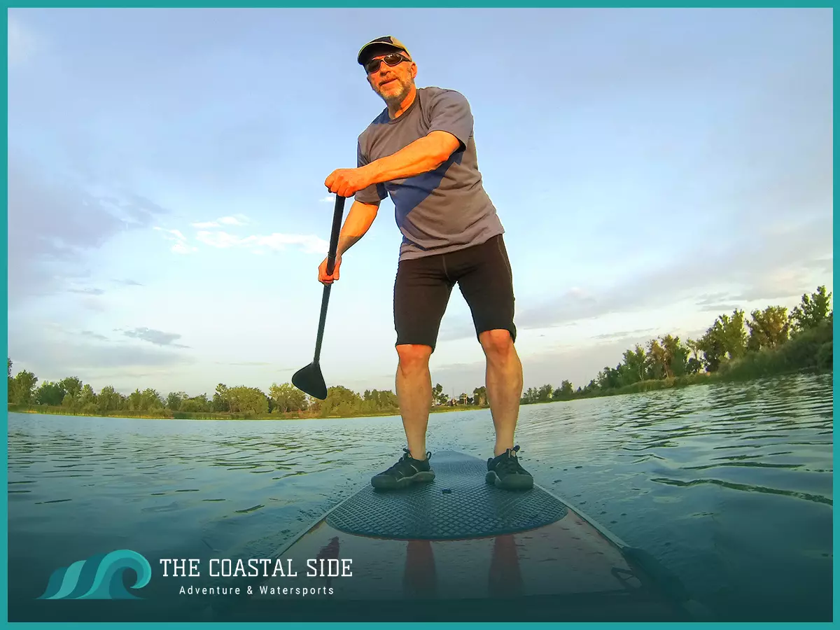 Man standing up paddle boarding