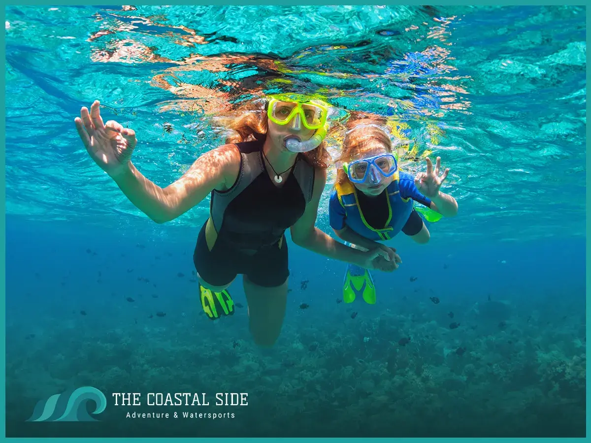 Kids snorkeling in the clear blue water