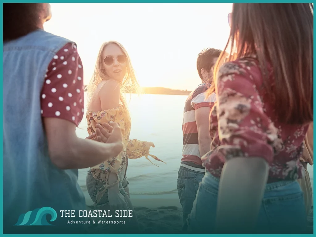 Group of friends in the sun on the beach