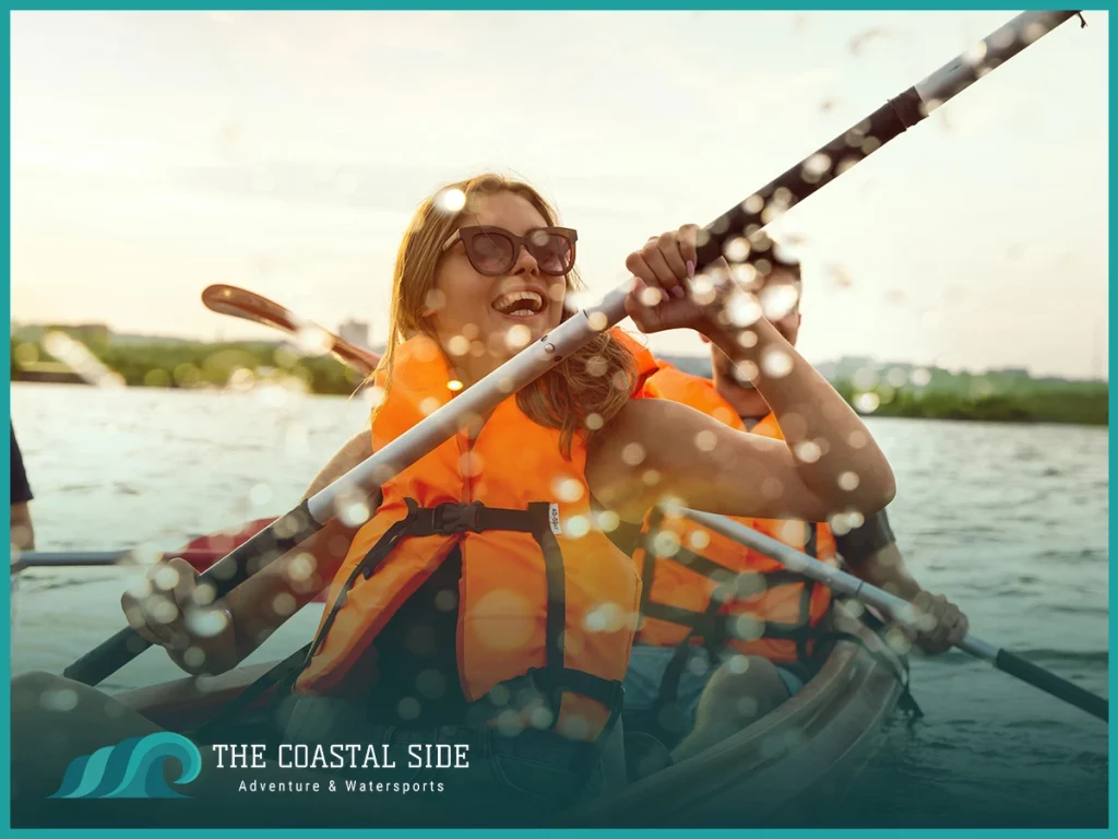 Woman in a life jacket in a kayak having fun