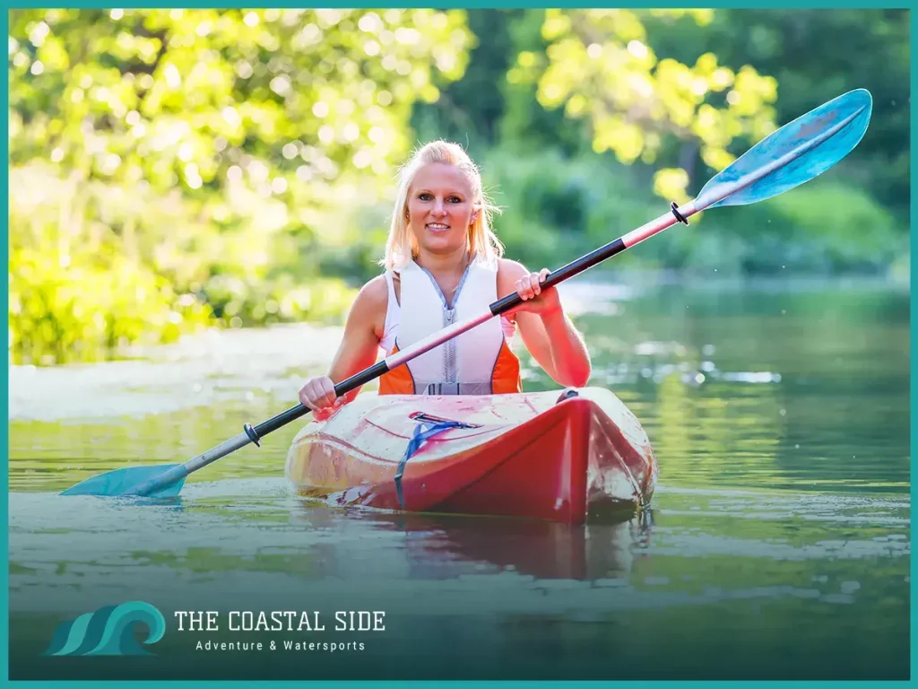 Woman kayaking wearing a life jacket