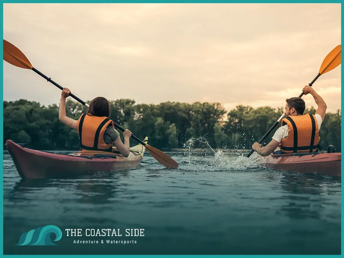 Kayaking on the lake wearing orange life jackets