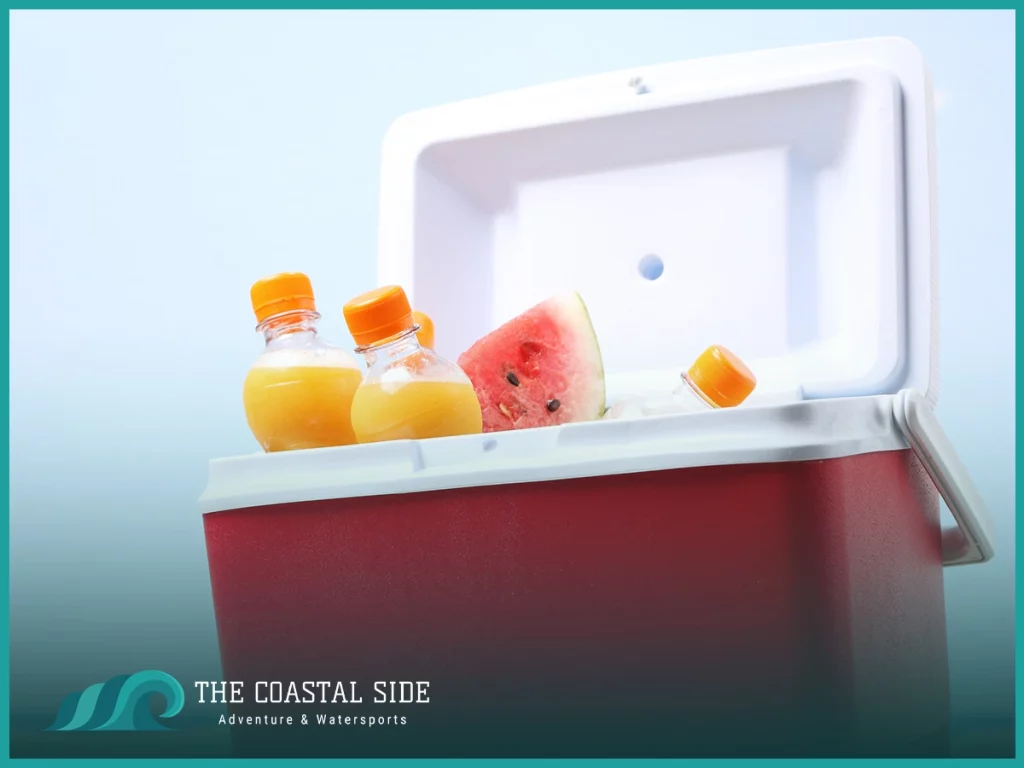 Red cooler with drinks and snacks