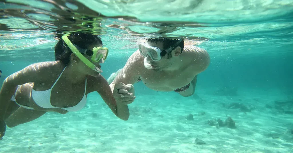 a couple snorkeling together in the ocean