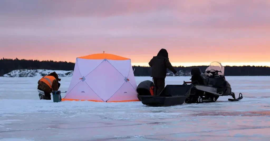 Snowmobile Ice Fishing Setup in Winter
