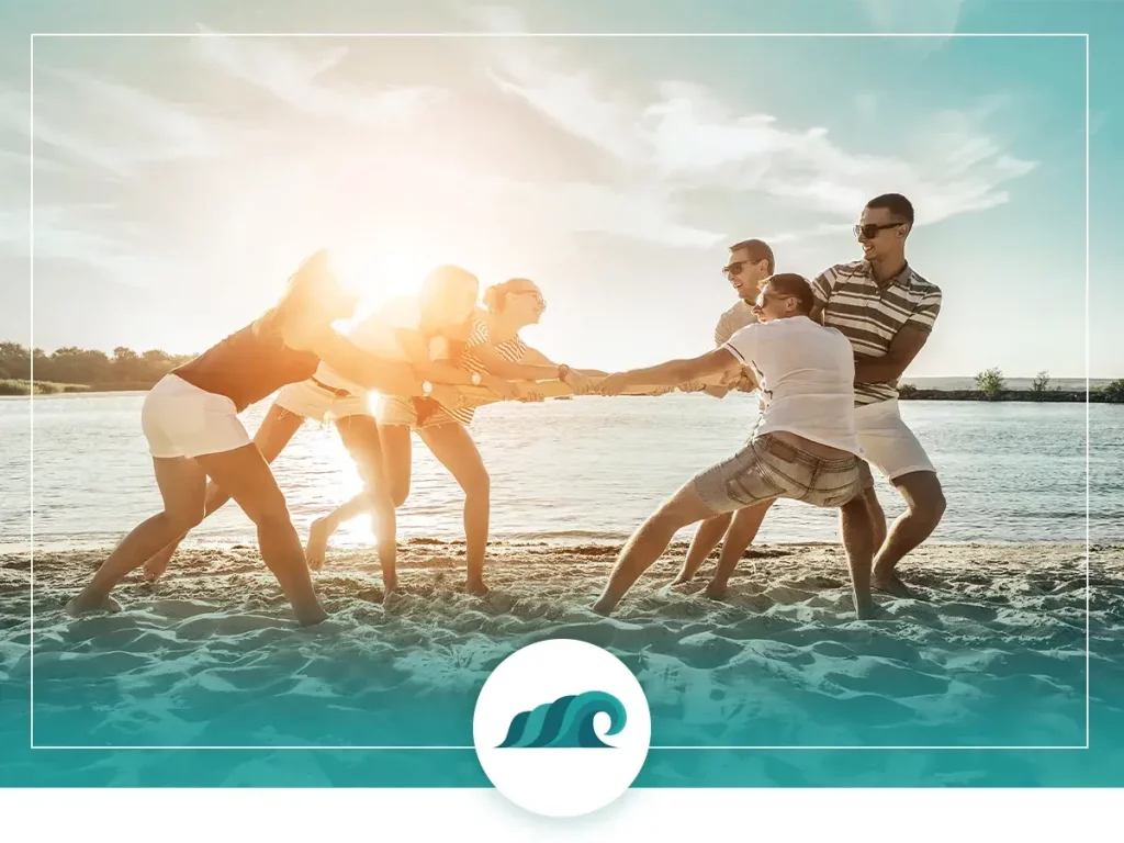 Tug of war on the beach in the sun